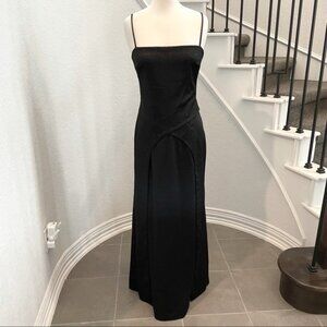 Like new, black formal dress with crystals. Layered detail. Ties in the back. 11